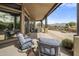 Spacious covered patio with comfortable seating and beautiful mountain views at 19131 E Tonto Verde Dr, Rio Verde, AZ 85263