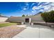 Backyard area with fireplace, white rock, new concrete and artificial turf at 19409 N 45Th Dr, Glendale, AZ 85308