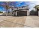 Two-story home boasts well-manicured gravel yard and a spacious driveway, providing ample parking at 19409 N 45Th Dr, Glendale, AZ 85308