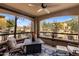 A cozy balcony with comfortable seating and views of the landscaped courtyard at 19700 N 76Th St # 1061, Scottsdale, AZ 85255