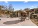 Community pool area with seating, BBQ, shade and desert landscaping at 19700 N 76Th St # 1061, Scottsdale, AZ 85255