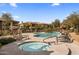 Community pool and spa offer a refreshing oasis, complemented by comfortable seating and lush surroundings at 19700 N 76Th St # 1061, Scottsdale, AZ 85255