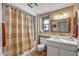 Full bathroom featuring a shower, toilet, vanity sink, and a neutral color scheme at 20639 N 123Rd Dr, Sun City West, AZ 85375