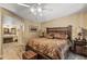 This lovely bedroom features wood-look floors and access to the vanity and bathroom at 20639 N 123Rd Dr, Sun City West, AZ 85375