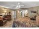 This comfortable bedroom showcases wood-look floors, neutral walls, and access to the bathroom at 20639 N 123Rd Dr, Sun City West, AZ 85375