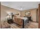 Bedroom featuring a ceiling fan, wood-look floors, and coordinated furniture at 20639 N 123Rd Dr, Sun City West, AZ 85375