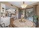 Light-filled breakfast nook with a view into the kitchen and out to the covered patio at 20639 N 123Rd Dr, Sun City West, AZ 85375