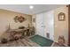 Tastefully decorated foyer with rustic wooden accents and decorative wall art, enhancing the entry at 20639 N 123Rd Dr, Sun City West, AZ 85375