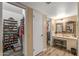 Hallway view of the closet and vanity area, perfect for staying organized at 20639 N 123Rd Dr, Sun City West, AZ 85375