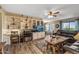 Stylish living room featuring built-in shelving, a desk area, and a comfortable leather sofa at 20639 N 123Rd Dr, Sun City West, AZ 85375