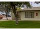 Exterior view highlighting the home's facade, greenery, and accessibility with a paved walkway at 2064 S Farnsworth Dr # 43, Mesa, AZ 85209