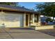 Inviting home with a two-car garage, brick accents, and manicured landscaping offering curb appeal at 2064 S Farnsworth Dr # 43, Mesa, AZ 85209