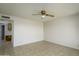 Bright living room features neutral walls, tile flooring, and a classic ceiling fan at 2064 S Farnsworth Dr # 43, Mesa, AZ 85209