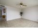 Bright living room featuring tile floors, ceiling fan, and neutral-toned walls at 2064 S Farnsworth Dr # 43, Mesa, AZ 85209