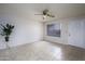 Bright living room featuring tile floors, ceiling fan, and white painted walls at 2064 S Farnsworth Dr # 43, Mesa, AZ 85209