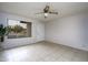 Bright living room featuring tile floors, ceiling fan, and white painted walls at 2064 S Farnsworth Dr # 43, Mesa, AZ 85209