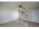 Inviting living room with neutral walls, tile flooring, and a door leading outside at 2064 S Farnsworth Dr # 43, Mesa, AZ 85209