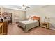 Bedroom featuring a ceiling fan, neutral paint, bookshelf and a cozy atmosphere at 2101 S Meridian Rd # 176, Apache Junction, AZ 85120