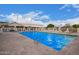 Community pool with ample seating, perfect for relaxation and enjoying sunny days at 2101 S Meridian Rd # 176, Apache Junction, AZ 85120