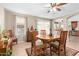 Bright dining room with natural light, tile flooring, and view of the kitchen area at 2101 S Meridian Rd # 176, Apache Junction, AZ 85120