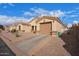 Inviting exterior featuring desert landscaping, a two-car garage, and a well-kept driveway at 2101 S Meridian Rd # 176, Apache Junction, AZ 85120