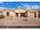 Charming home with a two-car garage, desert landscaping, and a cozy front porch at 2101 S Meridian Rd # 176, Apache Junction, AZ 85120