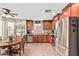 Well-lit kitchen featuring stainless steel appliances, tile floors, and a breakfast nook at 2101 S Meridian Rd # 176, Apache Junction, AZ 85120