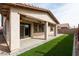 A covered patio with a lush, green turf lawn, ideal for outdoor activities and relaxing at 22465 E Via Del Verde --, Queen Creek, AZ 85142