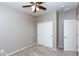 Neutral bedroom with a ceiling fan, carpeted floor, and double door closet at 22465 E Via Del Verde --, Queen Creek, AZ 85142