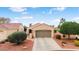 Charming single-story home with manicured landscaping, a two-car garage, and lovely curb appeal at 22524 N San Ramon Dr, Sun City West, AZ 85375