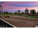 Gorgeous twilight view of the golf course and community with vibrant sky colors at 22524 N San Ramon Dr, Sun City West, AZ 85375