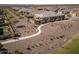 Aerial view of a home surrounded by walking paths with a lush green lawn and manicured landscaping in a serene community at 24847 N 175Th Dr, Surprise, AZ 85387