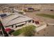 Aerial view of a private backyard showcasing cozy outdoor seating, a retractable awning, and low-maintenance artificial turf at 24847 N 175Th Dr, Surprise, AZ 85387