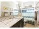 Bathroom featuring a granite countertop vanity, modern fixtures, and coordinated decor at 24847 N 175Th Dr, Surprise, AZ 85387