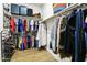 Walk-in closet with ample storage, shelving, and hanging space for clothes and accessories at 24847 N 175Th Dr, Surprise, AZ 85387