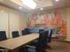 Bright conference room featuring a Route 66 mural, large table and blue chairs at 24847 N 175Th Dr, Surprise, AZ 85387