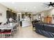 Open layout showcasing a modern kitchen flowing into a dining and living area with cohesive design at 24847 N 175Th Dr, Surprise, AZ 85387