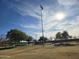 Scenic view of the community park featuring walking paths, mature trees, and recreational space at 24847 N 175Th Dr, Surprise, AZ 85387