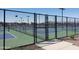 Community pickleball courts enclosed by a chain link fence ready for a game at 24847 N 175Th Dr, Surprise, AZ 85387