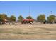 A colorful playground area featuring slides, and covered picnic spaces for families to enjoy at 24847 N 175Th Dr, Surprise, AZ 85387