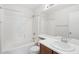 Full bathroom featuring a tiled shower and tub, a single vanity, and modern fixtures at 2502 S 90Th Gln, Tolleson, AZ 85353