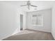 Bright bedroom with neutral carpet, closet, and a large window offers natural light at 2502 S 90Th Gln, Tolleson, AZ 85353