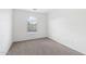 Neutral bedroom with plush carpet, a window, and light walls at 2502 S 90Th Gln, Tolleson, AZ 85353