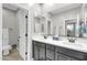 Bathroom features a dual vanity, mirror, toilet, and modern fixtures at 256 N Jesse St, Chandler, AZ 85225