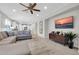 Open concept living room leading to a spacious kitchen and dining area at 256 N Jesse St, Chandler, AZ 85225