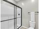 Clean bathroom features a shower stall with black-framed sliding glass doors at 256 N Jesse St, Chandler, AZ 85225