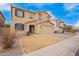 Two story home featuring blue shutters and tan stucco exterior at 28282 N Castle Rock Dr, San Tan Valley, AZ 85143