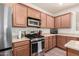 Well-equipped kitchen with stainless steel gas range and microwave at 28282 N Castle Rock Dr, San Tan Valley, AZ 85143