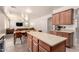 Open concept kitchen with dining area and a glimpse into the living room at 28282 N Castle Rock Dr, San Tan Valley, AZ 85143