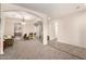 Inviting living room featuring large bookshelves and an archway at 28282 N Castle Rock Dr, San Tan Valley, AZ 85143